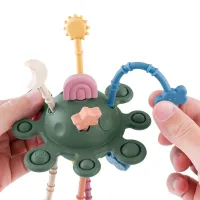 Jucarie senzoriala din silicon Petite&Mars Crazy Planet Misty Green (10+ luni)